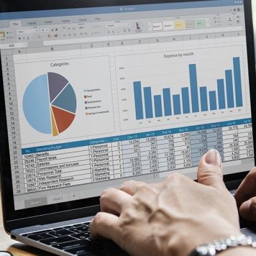Business people working on a laptop in a meeting